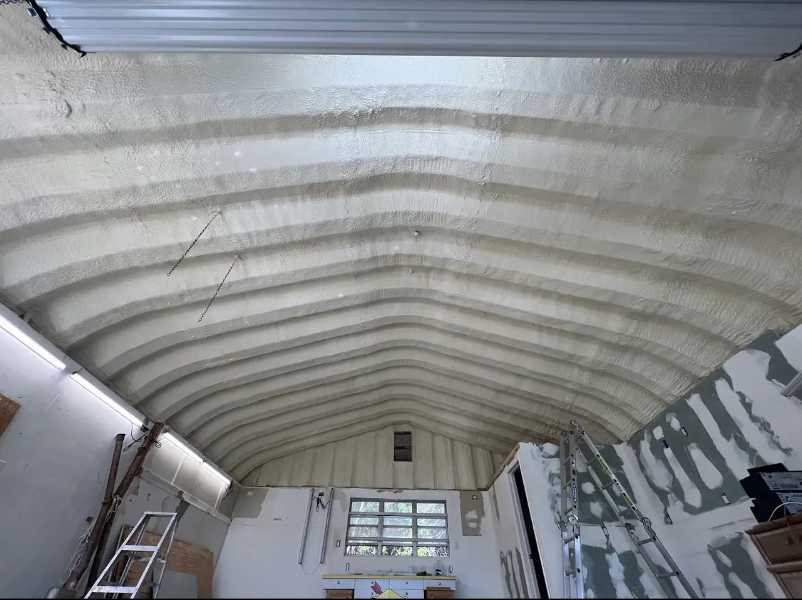 Spray polyurethane foam applied to the underside of a metal roof deck in Pingree Grove